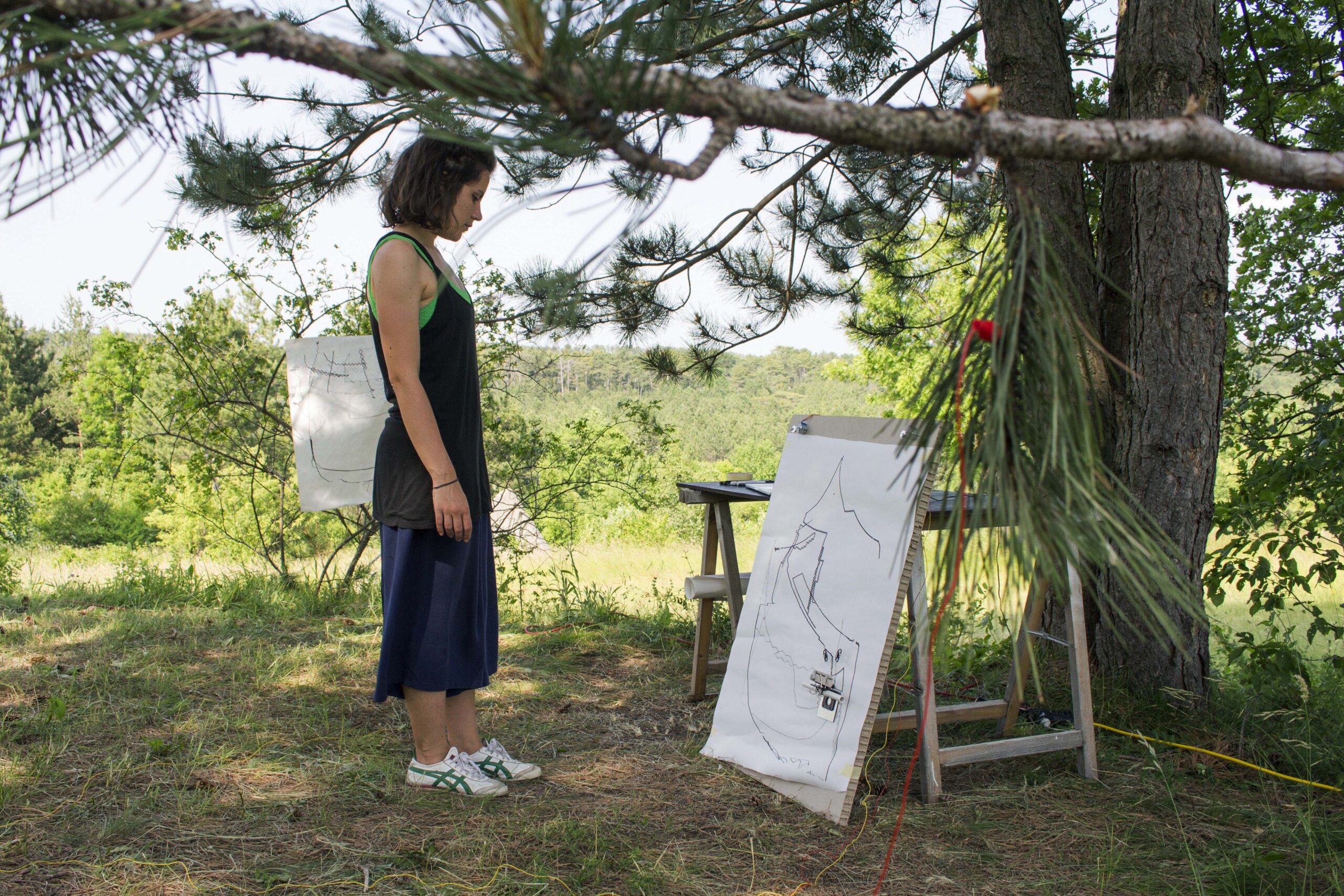 erika glionna looking at duet canvas in the wood